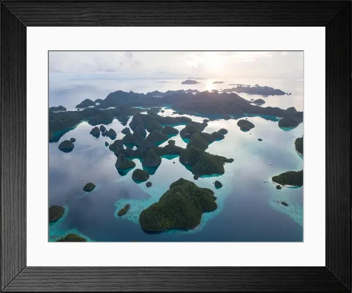 Framed Print : An amazing set of limestone islands are found in a remote part of Raja Ampat, Indonesia. These tropical islands are surrounded by healthy coral reefs Framed Print : An amazing set of limestone islands are found in a remote part of Raja Ampat, Indonesia. These tropical islands are surrounded by healthy coral reefs