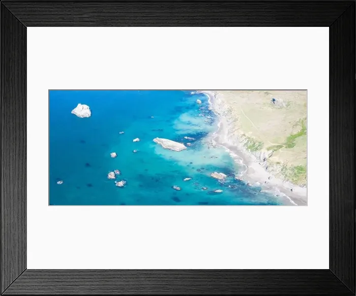 Framed Print : The colorful and almost peaceful Pacific Ocean washes against the rocky Northern California coastline on a beautiful day