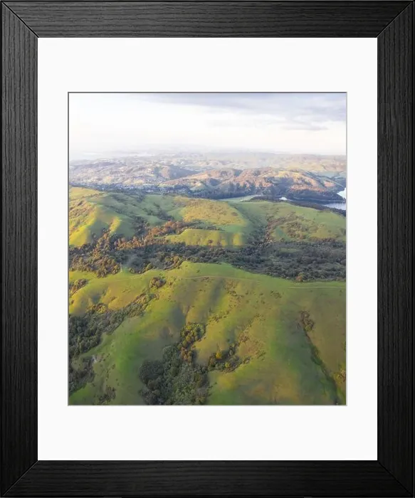 Framed Print : Evening sunlight shines on the green hills of the East Bay in Northern California. This area, east of San Francisco Bay, is green in the winter Framed Print : Evening sunlight shines on the green hills of the East Bay in Northern California. This area, east of San Francisco Bay, is green in the winter