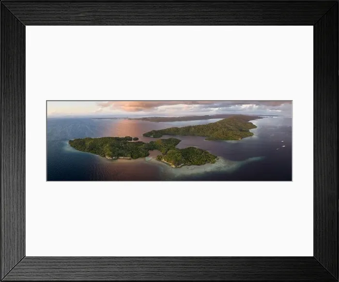 Framed Print : Beautiful coral reefs fringe the islands throughout Raja Ampat, Indonesia. This tropical area is known for its incredibly high marine biodiversity Framed Print : Beautiful coral reefs fringe the islands throughout Raja Ampat, Indonesia. This tropical area is known for its incredibly high marine biodiversity
