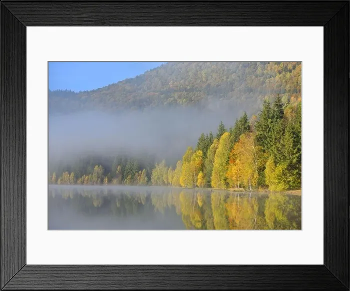 Framed Print : Autumn landscape in the mountains with trees reflecting in the water at St. Ana's lake, Romania Framed Print : Autumn landscape in the mountains with trees reflecting in the water at St. Ana's lake, Romania