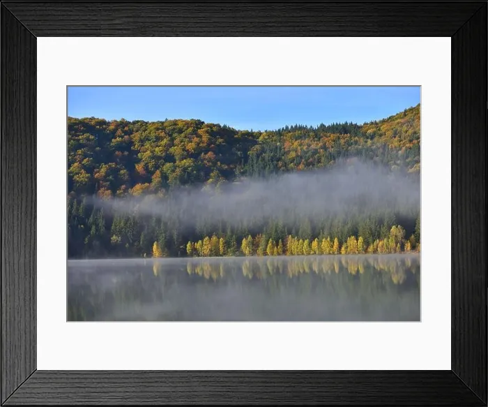 Framed Print : Autumn landscape in the mountains with trees reflecting in the water at St. Ana's lake, Romania Framed Print : Autumn landscape in the mountains with trees reflecting in the water at St. Ana's lake, Romania