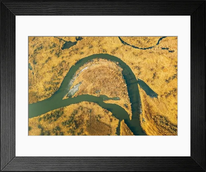 Framed Print : Belarus. Aerial View Of Dry Grass And Partly Frozen Curved River Landscape In Late Autumn Day. High Attitude View. Marsh Bog. Drone View. Bird's Eye V Framed Print : Belarus. Aerial View Of Dry Grass And Partly Frozen Curved River Landscape In Late Autumn Day. High Attitude View. Marsh Bog. Drone View. Bird's Eye V