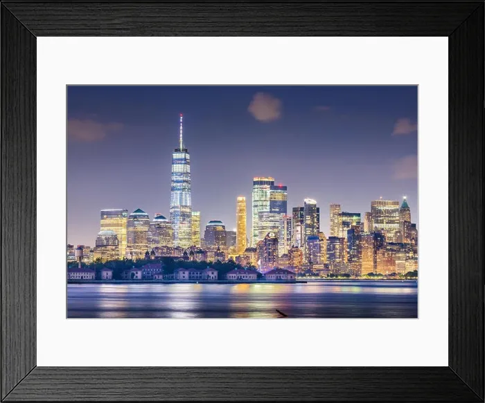 Framed Print : New York, New York, USA skyline from the harbor with Ellis Island at night Framed Print : New York, New York, USA skyline from the harbor with Ellis Island at night