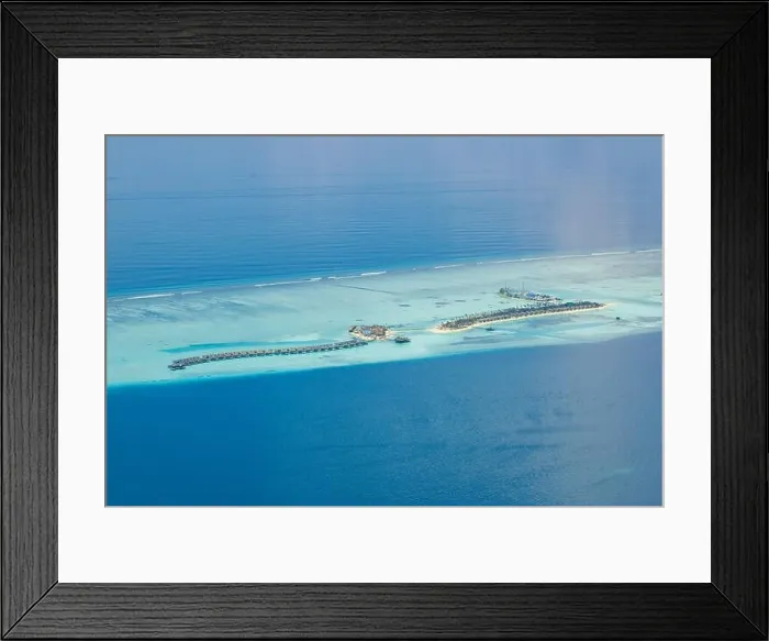 Framed Print : Aerial view on Maldives island. Luxury water and beach villas, bungalows with amazing nature seascape landscape. Luxury travel and vacation Framed Print : Aerial view on Maldives island. Luxury water and beach villas, bungalows with amazing nature seascape landscape. Luxury travel and vacation