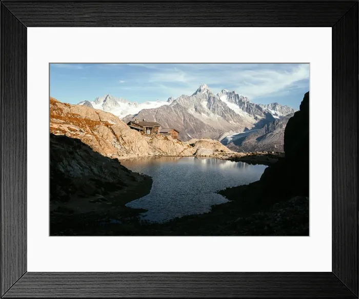 Framed Print : Picturesque view of clear water and mountains reflection on Lac Blanc lake in France Alps. Monte Bianco mountain range on background Framed Print : Picturesque view of clear water and mountains reflection on Lac Blanc lake in France Alps. Monte Bianco mountain range on background