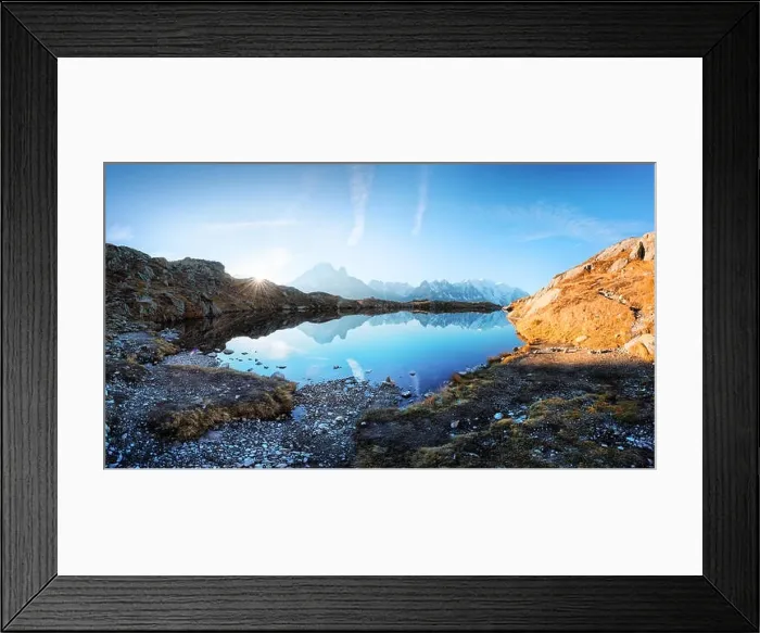Framed Print : Sun rising on Chesery lake (Lac De Cheserys) in France Alps. Monte Bianco mountain range on background. Landscape photography, Chamonix Framed Print : Sun rising on Chesery lake (Lac De Cheserys) in France Alps. Monte Bianco mountain range on background. Landscape photography, Chamonix