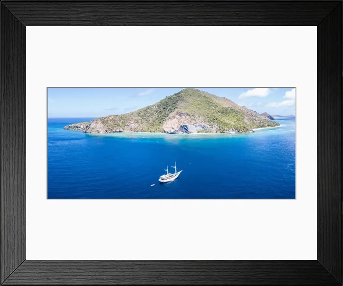 Framed Print : A remote tropical island in the Banda Sea is surrounded by a beautiful coral reef. This region of Indonesia is home to extraordinary biodiversity Framed Print : A remote tropical island in the Banda Sea is surrounded by a beautiful coral reef. This region of Indonesia is home to extraordinary biodiversity