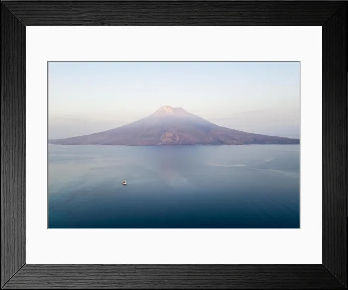 Framed Print : Sunrise illuminates the Iliape volcano found just east of Flores, Indonesia. This tropical area is part of the famous Ring of Fire Framed Print : Sunrise illuminates the Iliape volcano found just east of Flores, Indonesia. This tropical area is part of the famous Ring of Fire