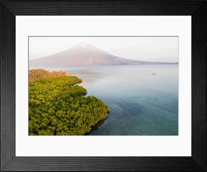 Framed Print : Sunrise illuminates the Iliape volcano found just east of Flores, Indonesia. This tropical area is part of the famous Ring of Fire Framed Print : Sunrise illuminates the Iliape volcano found just east of Flores, Indonesia. This tropical area is part of the famous Ring of Fire