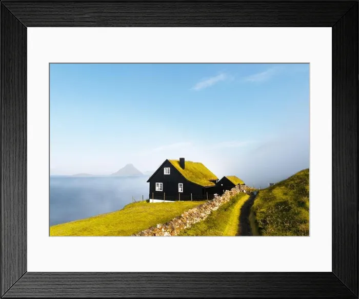 Framed Print : Foggy morning view of a house with typical turf-top grass roof in the Velbastadur village on Streymoy island, Faroe islands, Denmark Framed Print : Foggy morning view of a house with typical turf-top grass roof in the Velbastadur village on Streymoy island, Faroe islands, Denmark