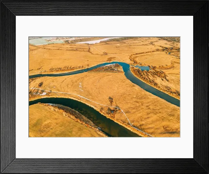Framed Print : Belarus. Aerial View Of Dry Grass And Partly Frozen Curved River Landscape In Late Autumn Day. High Attitude View. Marsh Bog. Drone View. Bird's Eye V Framed Print : Belarus. Aerial View Of Dry Grass And Partly Frozen Curved River Landscape In Late Autumn Day. High Attitude View. Marsh Bog. Drone View. Bird's Eye V