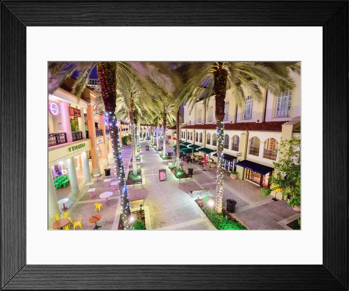 Framed Print : WEST PALM BEACH, FLORIDA - APRIL 3, 2016: Palm trees line CityPlace at night. The mixed-use development was finished in 2000 Framed Print : WEST PALM BEACH, FLORIDA - APRIL 3, 2016: Palm trees line CityPlace at night. The mixed-use development was finished in 2000