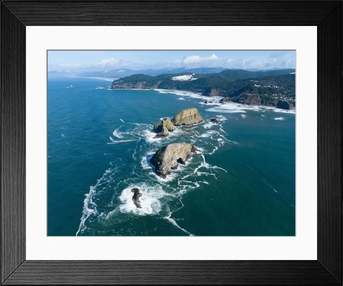 Framed Print : Sunlight shines on rugged sea stacks off the northern coast of Oregon, not far from Tillamook. This coastline has many outstanding viewpoints Framed Print : Sunlight shines on rugged sea stacks off the northern coast of Oregon, not far from Tillamook. This coastline has many outstanding viewpoints