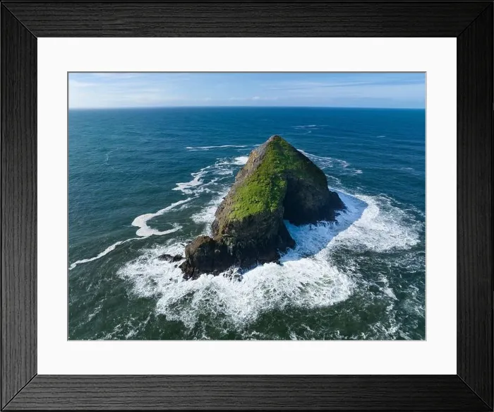 Framed Print : Bright sunlight shines on a solitary sea stack off the northern coast of Oregon, not far from Tillamook. This coastline has many beautiful viewpoints Framed Print : Bright sunlight shines on a solitary sea stack off the northern coast of Oregon, not far from Tillamook. This coastline has many beautiful viewpoints