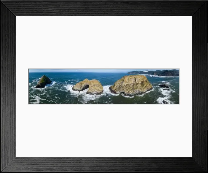 Framed Print : Sunlight shines on rugged sea stacks off the northern coast of Oregon, not far from Tillamook. This coastline has many outstanding viewpoints Framed Print : Sunlight shines on rugged sea stacks off the northern coast of Oregon, not far from Tillamook. This coastline has many outstanding viewpoints