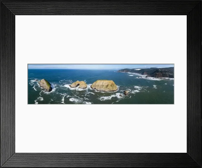 Framed Print : Sunlight shines on rugged sea stacks off the northern coast of Oregon, not far from Tillamook. This coastline has many outstanding viewpoints Framed Print : Sunlight shines on rugged sea stacks off the northern coast of Oregon, not far from Tillamook. This coastline has many outstanding viewpoints