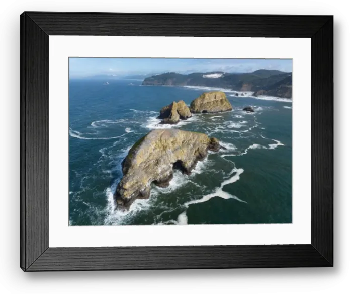 Framed Print : Sunlight shines on rugged sea stacks off the northern coast of Oregon, not far from Tillamook. This coastline has many outstanding viewpoints Framed Print : Sunlight shines on rugged sea stacks off the northern coast of Oregon, not far from Tillamook. This coastline has many outstanding viewpoints