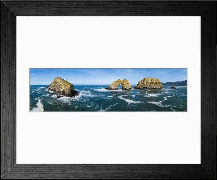 Framed Print : Sunlight shines on rugged sea stacks off the northern coast of Oregon, not far from Tillamook. This coastline has many outstanding viewpoints Framed Print : Sunlight shines on rugged sea stacks off the northern coast of Oregon, not far from Tillamook. This coastline has many outstanding viewpoints