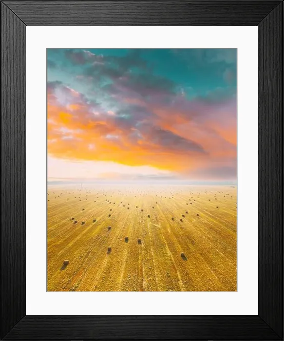 Framed Print : Aerial View Of Summer Hay Rolls Straw Field Landscape In Summer Sunny Day. Bright Orange Blue Sky Above Field Landscape. Harvest Season. Elevated View Framed Print : Aerial View Of Summer Hay Rolls Straw Field Landscape In Summer Sunny Day. Bright Orange Blue Sky Above Field Landscape. Harvest Season. Elevated View