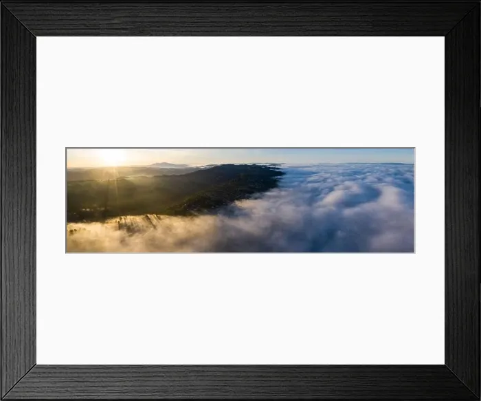 Framed Print : Sunrise illuminates the marine layer covering the entirety of San Francisco Bay. The foggy marine layer is an almost daily climatic phenomenon Framed Print : Sunrise illuminates the marine layer covering the entirety of San Francisco Bay. The foggy marine layer is an almost daily climatic phenomenon