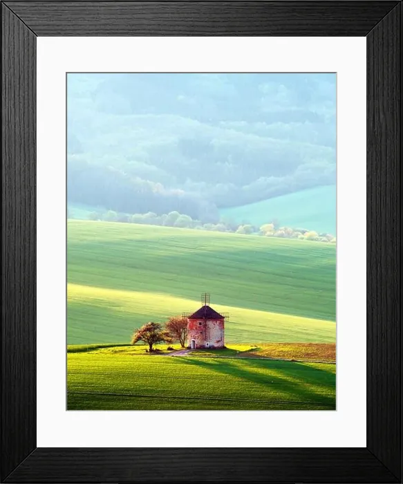 Framed Print : Picturesque rural landscape with old windmill and green sunny spring hills. South Moravia region, Czech Republic Framed Print : Picturesque rural landscape with old windmill and green sunny spring hills. South Moravia region, Czech Republic