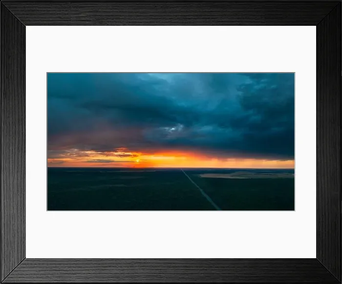 Framed Print : Aerial View Of Sunset Sky Above Highway Road Through Green Forest Landscape In Sunny Evening. Top View Of Highway Motorway Freeway From High Attitude Framed Print : Aerial View Of Sunset Sky Above Highway Road Through Green Forest Landscape In Sunny Evening. Top View Of Highway Motorway Freeway From High Attitude