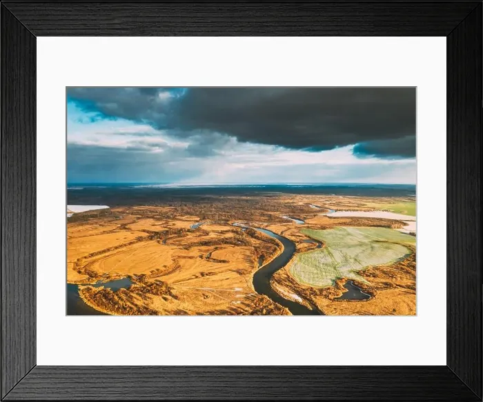 Framed Print : Europe. Aerial View Of Dry Grass And Partly Frozen Curved River Landscape In Autumn Day. High Attitude View. Marsh Bog. Drone View. Bird's Eye View Framed Print : Europe. Aerial View Of Dry Grass And Partly Frozen Curved River Landscape In Autumn Day. High Attitude View. Marsh Bog. Drone View. Bird's Eye View