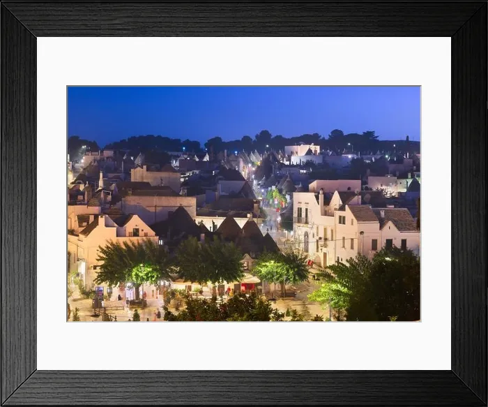 Framed Print : Alberobello, Italy with Trulli houses at dusk Framed Print : Alberobello, Italy with Trulli houses at dusk
