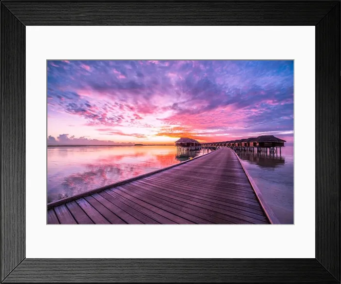 Framed Print : Amazing abstract background. Beautiful sunset colors in Maldives. Long jetty and luxury overwater villas Framed Print : Amazing abstract background. Beautiful sunset colors in Maldives. Long jetty and luxury overwater villas