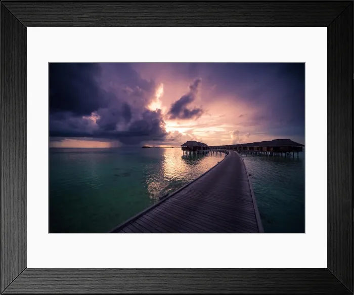 Framed Print : Amazing abstract background. Beautiful sunset colors in Maldives. Long jetty and luxury overwater villas Framed Print : Amazing abstract background. Beautiful sunset colors in Maldives. Long jetty and luxury overwater villas