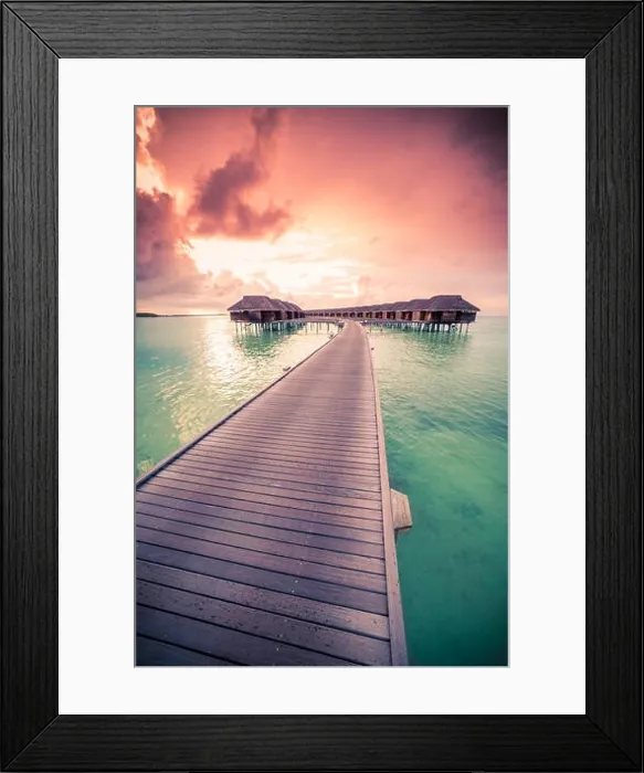 Framed Print : Amazing abstract background. Beautiful sunset colors in Maldives. Long jetty and luxury overwater villas Framed Print : Amazing abstract background. Beautiful sunset colors in Maldives. Long jetty and luxury overwater villas