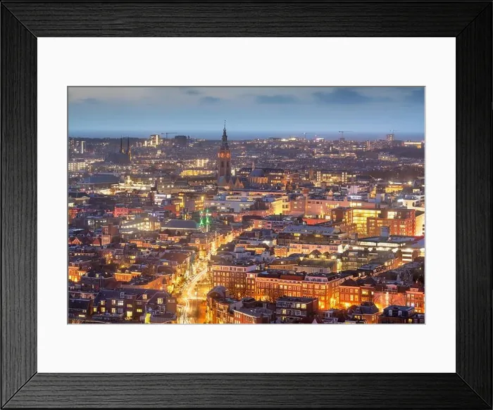 Framed Print : The Hague, Netherlands cityscape with Grote of Sint-Jacobskerk tower in the distance at dusk Framed Print : The Hague, Netherlands cityscape with Grote of Sint-Jacobskerk tower in the distance at dusk