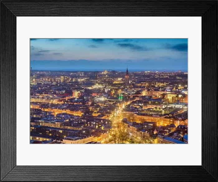 Framed Print : The Hague, Netherlands cityscape with Grote of Sint-Jacobskerk tower in the distance at dusk Framed Print : The Hague, Netherlands cityscape with Grote of Sint-Jacobskerk tower in the distance at dusk