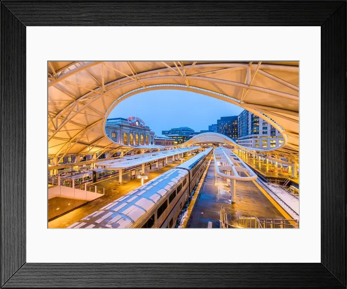 Framed Print : DENVER, COLORADO - MARCH 13, 2019: Trains out of service at Union Station after the Bomb Cyclone winter weather event. The central portion of the st Framed Print : DENVER, COLORADO - MARCH 13, 2019: Trains out of service at Union Station after the Bomb Cyclone winter weather event. The central portion of the st