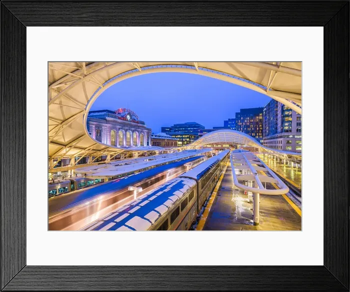 Framed Print : DENVER, COLORADO - MARCH 13, 2019: Trains out of service at Union Station after the Bomb Cyclone winter weather event. The central portion of the st Framed Print : DENVER, COLORADO - MARCH 13, 2019: Trains out of service at Union Station after the Bomb Cyclone winter weather event. The central portion of the st