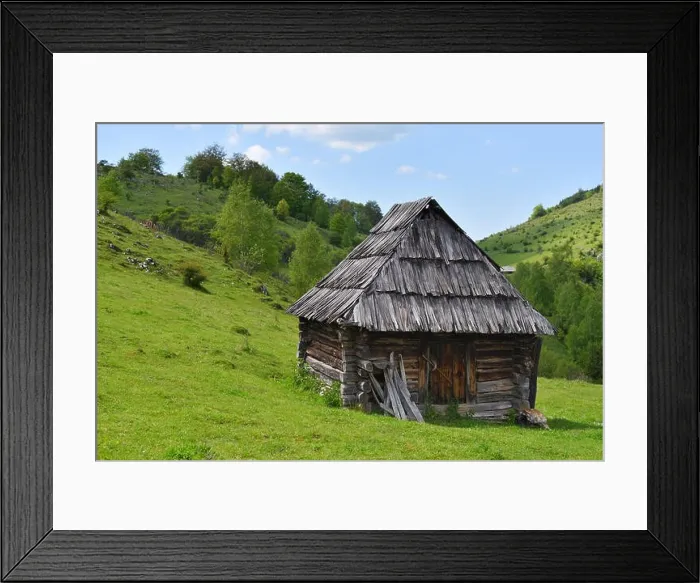 Framed Print : Lonely old wood house on a mountain hill against cloudy sky Framed Print : Lonely old wood house on a mountain hill against cloudy sky