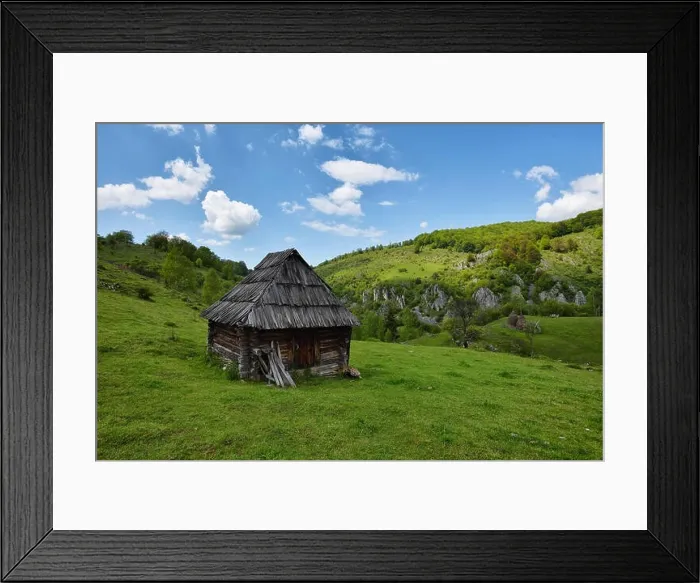 Framed Print : Lonely old wood house on a mountain hill against cloudy sky Framed Print : Lonely old wood house on a mountain hill against cloudy sky
