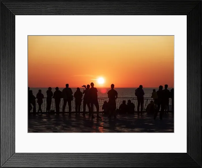 Framed Print : Silhouettes of people against the setting sun on deck of a cruise ship. Calm ocean and clear orange sky in evening time. Cruise vacations background Framed Print : Silhouettes of people against the setting sun on deck of a cruise ship. Calm ocean and clear orange sky in evening time. Cruise vacations background