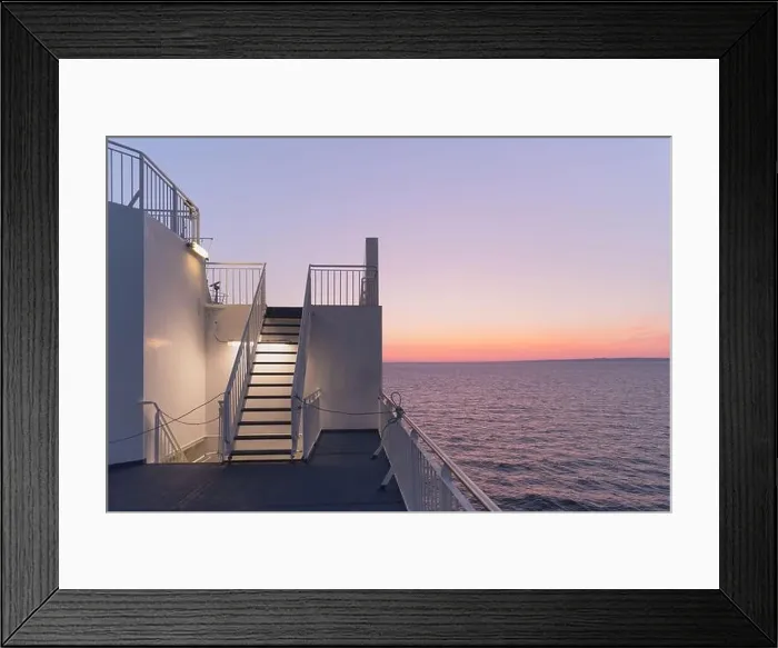 Framed Print : Deck of a cruise ship during sunset. Calm ocean and clear pink sky in evening time. Cruise vacations background. Minimalism in photography Framed Print : Deck of a cruise ship during sunset. Calm ocean and clear pink sky in evening time. Cruise vacations background. Minimalism in photography