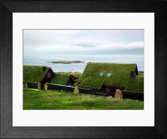 Framed Print : Foggy morning view of a house with typical turf-top grass roof and blue cloudy sky in the Velbastadur village on Streymoy island, Faroe islands Framed Print : Foggy morning view of a house with typical turf-top grass roof and blue cloudy sky in the Velbastadur village on Streymoy island, Faroe islands