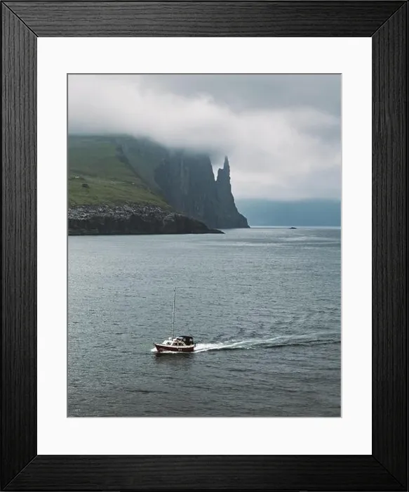 Framed Print : Gorgeous faroese landscape with famous Witches Finger cliffs and dramatic cloudy sky. Vagar island, Faroe Islands, Denmark Framed Print : Gorgeous faroese landscape with famous Witches Finger cliffs and dramatic cloudy sky. Vagar island, Faroe Islands, Denmark