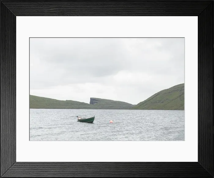 Framed Print : Morning view on lonely boat on cloudy Sorvagsvatn lake on cliffs of Vagar island, Faroe Islands, Denmark. Landscape photography Framed Print : Morning view on lonely boat on cloudy Sorvagsvatn lake on cliffs of Vagar island, Faroe Islands, Denmark. Landscape photography