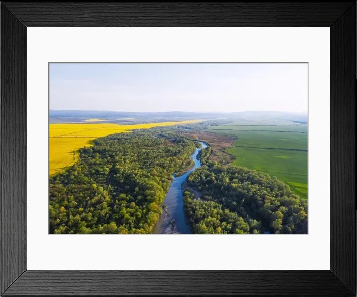 Framed Print : Flight through majestic river Dnister, lush green forest and blooming yellow rapeseed fields at sunset time. Ukraine, Europe. Landscape photography Framed Print : Flight through majestic river Dnister, lush green forest and blooming yellow rapeseed fields at sunset time. Ukraine, Europe. Landscape photography