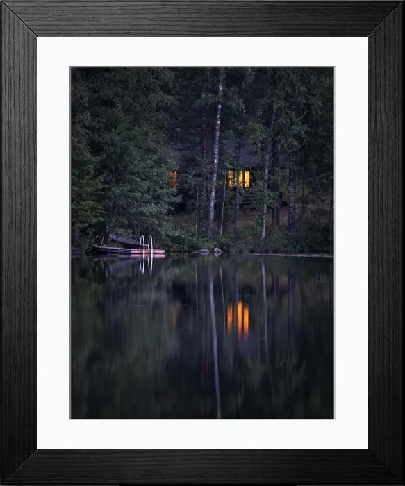 Framed Print : Idyllic cottage view with cozy cottage and window ligth at tranquil summer night in Finland Framed Print : Idyllic cottage view with cozy cottage and window ligth at tranquil summer night in Finland