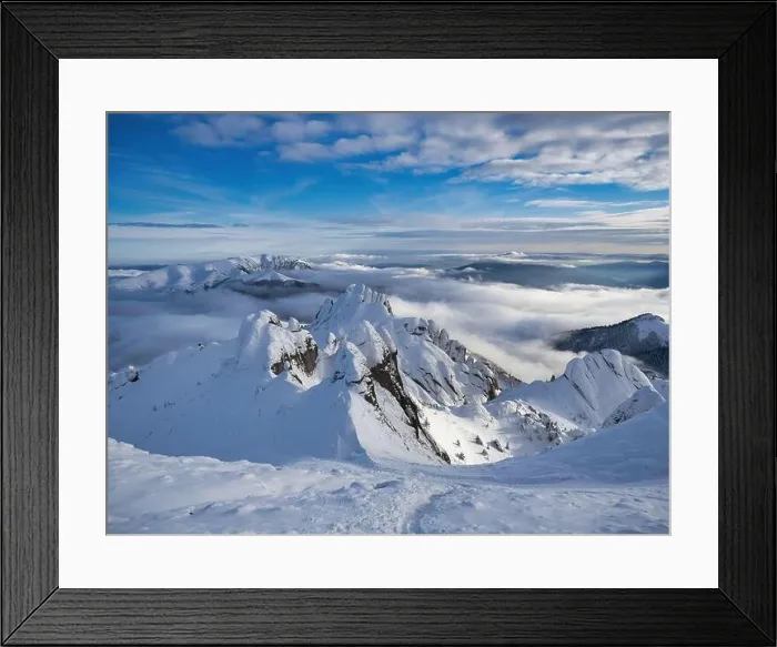 Framed Print : Aerial view of distant mountain peaks above clouds in clear sunny blue sky Framed Print : Aerial view of distant mountain peaks above clouds in clear sunny blue sky