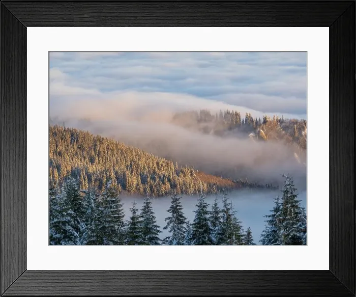 Framed Print : Aerial view of distant mountain peaks above clouds in clear sunny blue sky Framed Print : Aerial view of distant mountain peaks above clouds in clear sunny blue sky