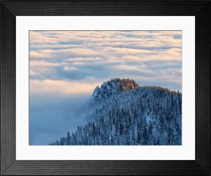 Framed Print : Aerial view of distant mountain peaks above clouds in clear sunny blue sky Framed Print : Aerial view of distant mountain peaks above clouds in clear sunny blue sky
