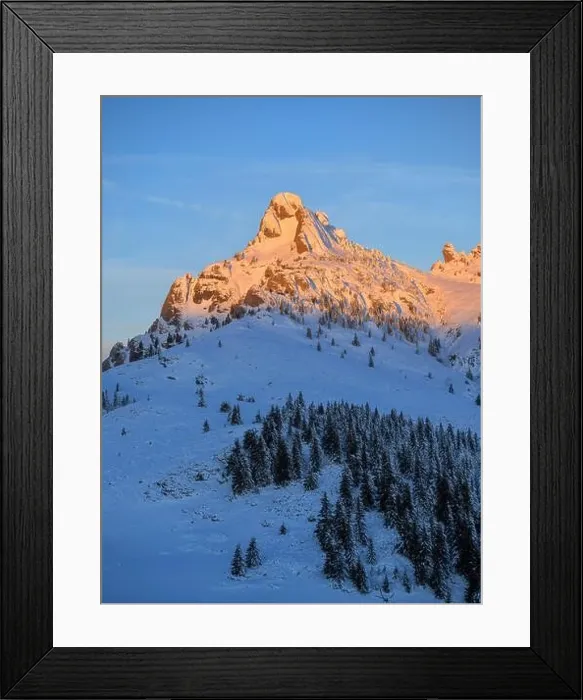 Framed Print : Mountain peak with sharp edges in warm sunrise warm light. Cold winter morning over a snow covered mountain Framed Print : Mountain peak with sharp edges in warm sunrise warm light. Cold winter morning over a snow covered mountain