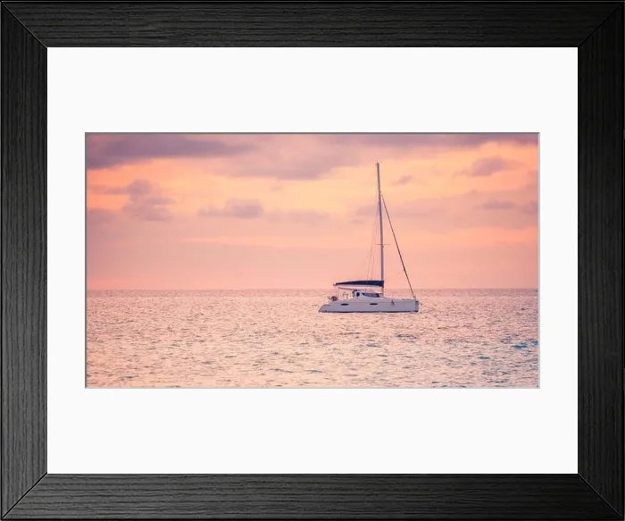 Framed Print : Sunset views at the sea with a yacht or silhouette of catamaran. Luxury travel and tourism vacation. Summer recreational background, seascape Framed Print : Sunset views at the sea with a yacht or silhouette of catamaran. Luxury travel and tourism vacation. Summer recreational background, seascape